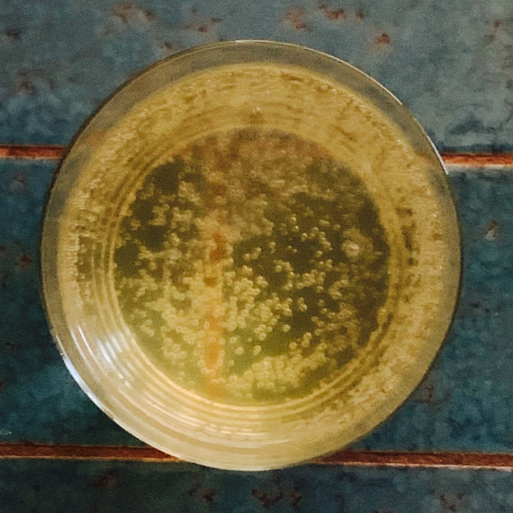 top down view of a glass of ginger ale
